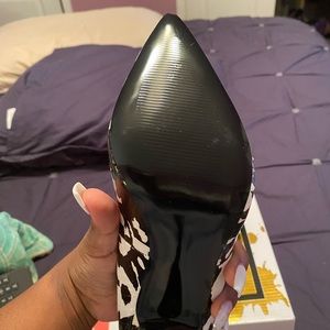 Black and white pointed toe heels